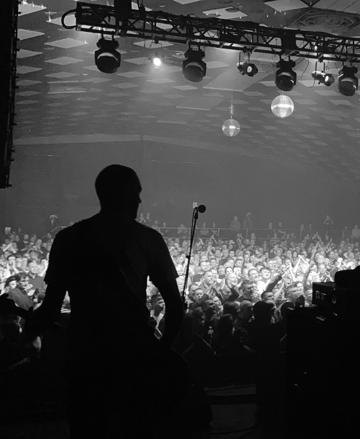 Lead vocalist of Goodbye Mr Mackenzie singing into a microphone